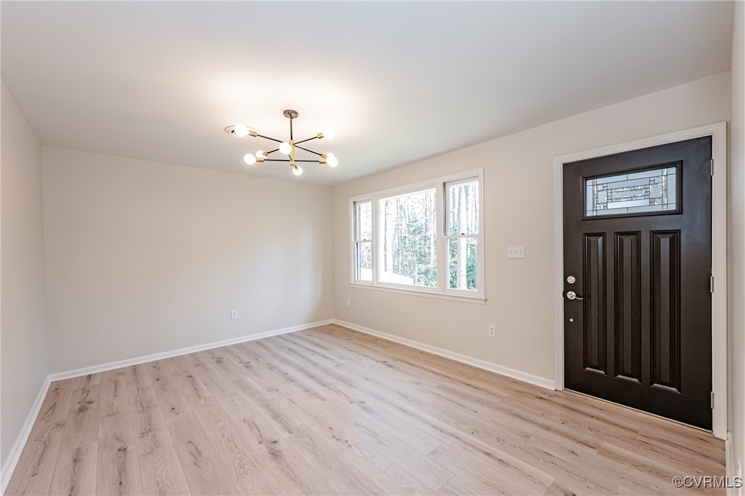16120 Rowlett Road Chesterfield, VA 23838 - Photo 7 of 25 wooden floor in an empty room with a window