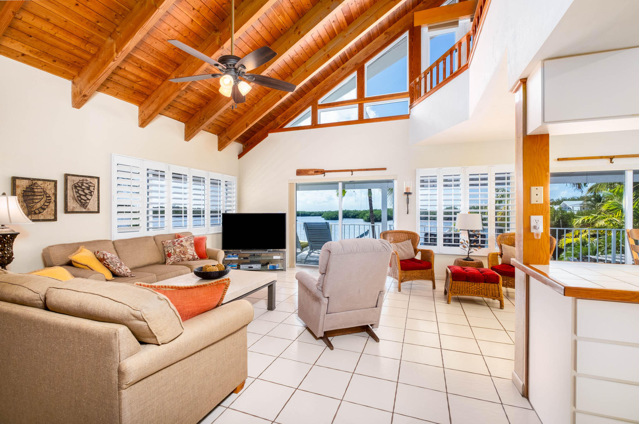 149 Lake Road Tavernier, FL 33070 - Photo 59 of 59 a living room with patio furniture and a flat screen tv