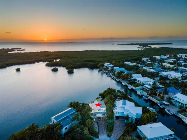 an aerial view of multiple house with outdoor space