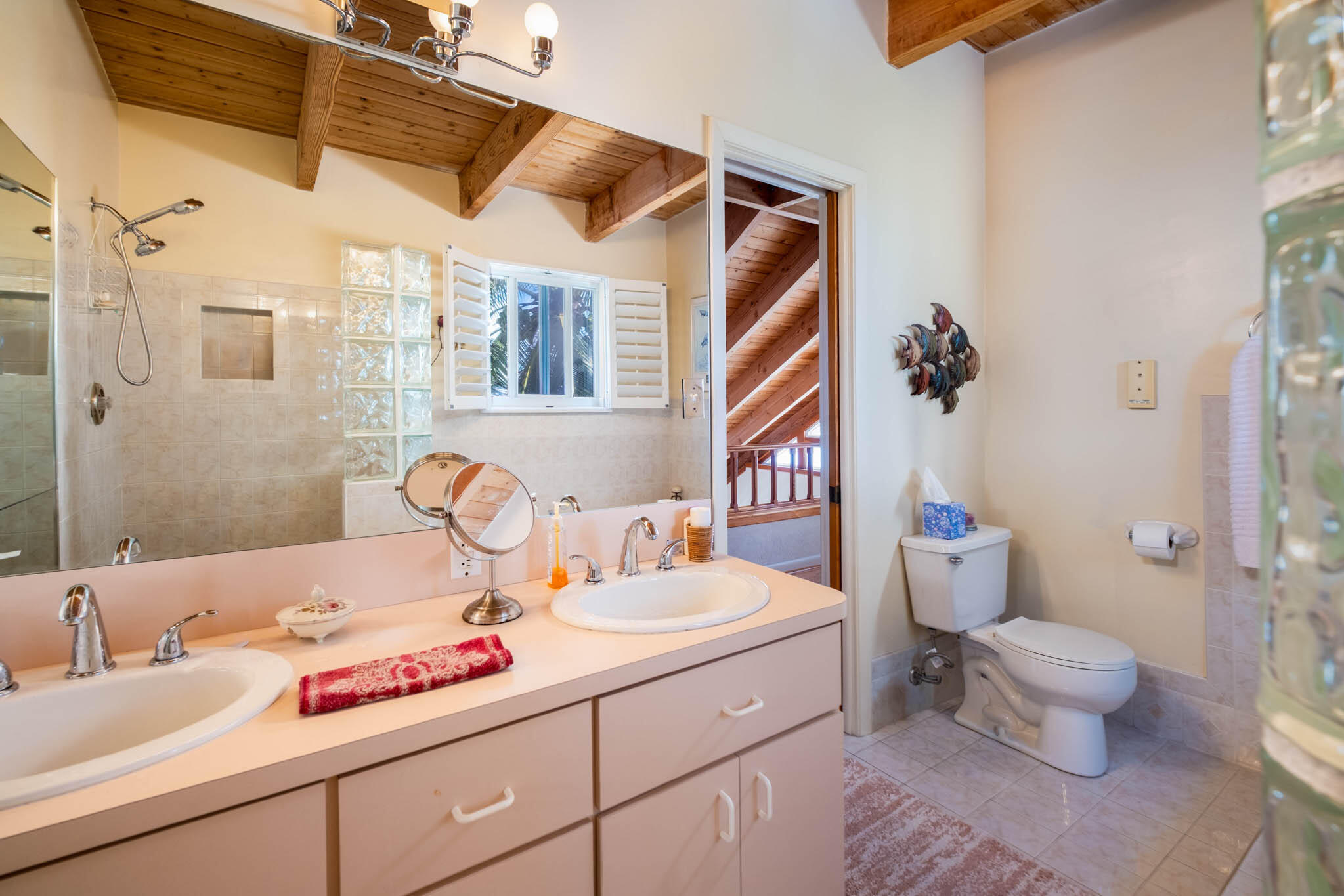 149 Lake Road Tavernier, FL 33070 - Photo 20 of 59 a bathroom with a granite countertop sink mirror vanity and toilet