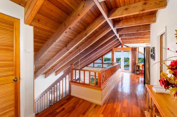 a view of a balcony with wooden fence