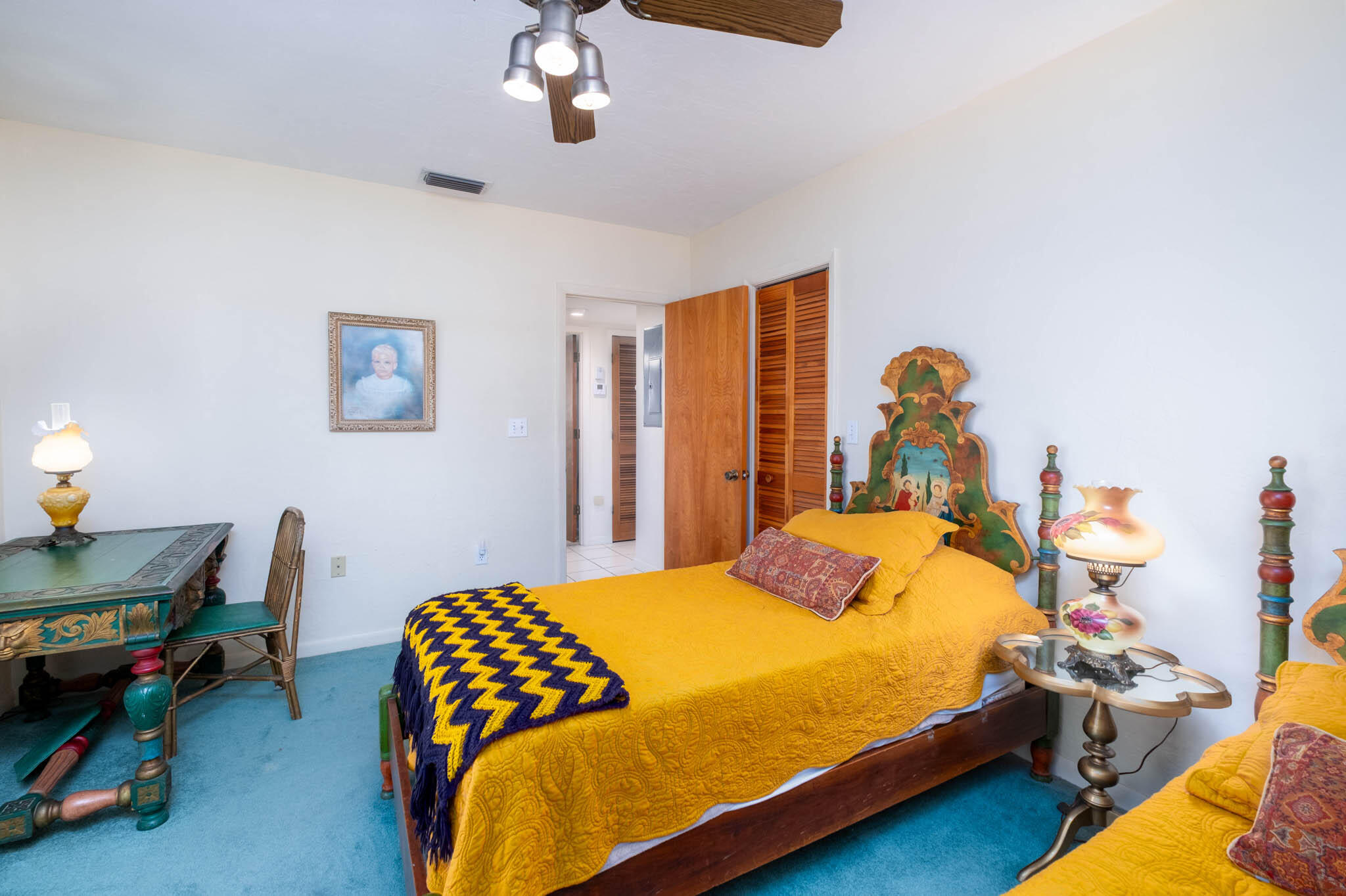 149 Lake Road Tavernier, FL 33070 - Photo 33 of 59 a bedroom with a bed and a chandelier