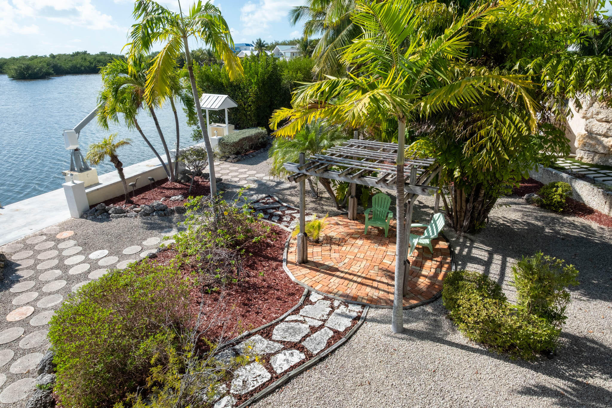 149 Lake Road Tavernier, FL 33070 - Photo 40 of 59 a view of a yard with plants and large trees
