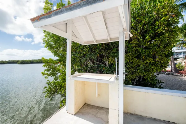 an aerial view of house with ocean view
