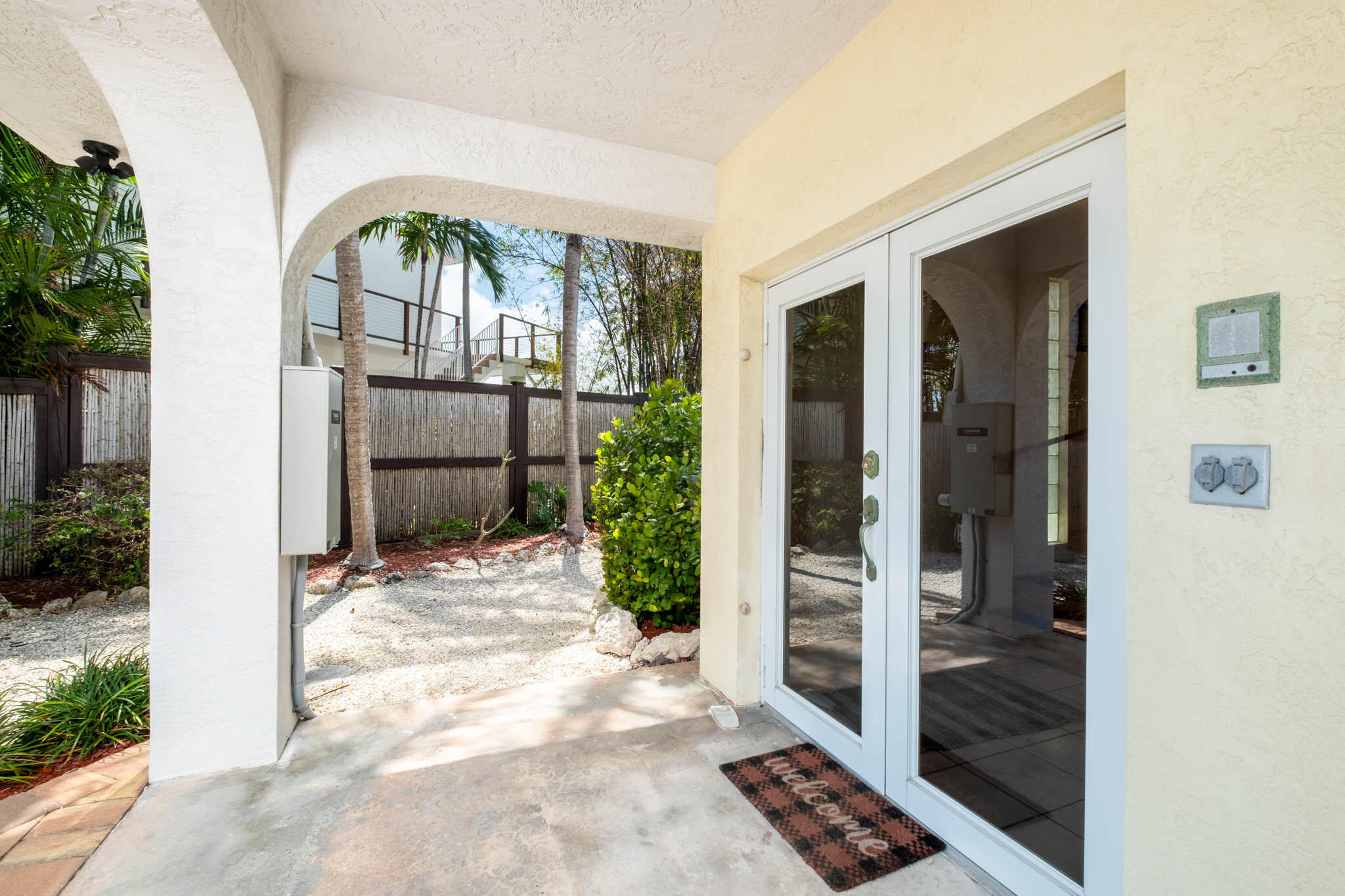 149 Lake Road Tavernier, FL 33070 - Photo 10 of 59 front view of a house with a glass door