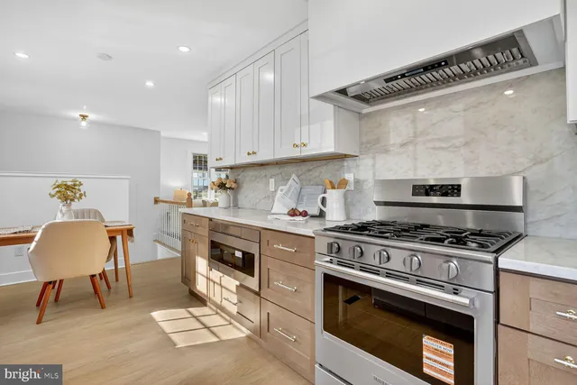 a kitchen with a stove a sink and a refrigerator