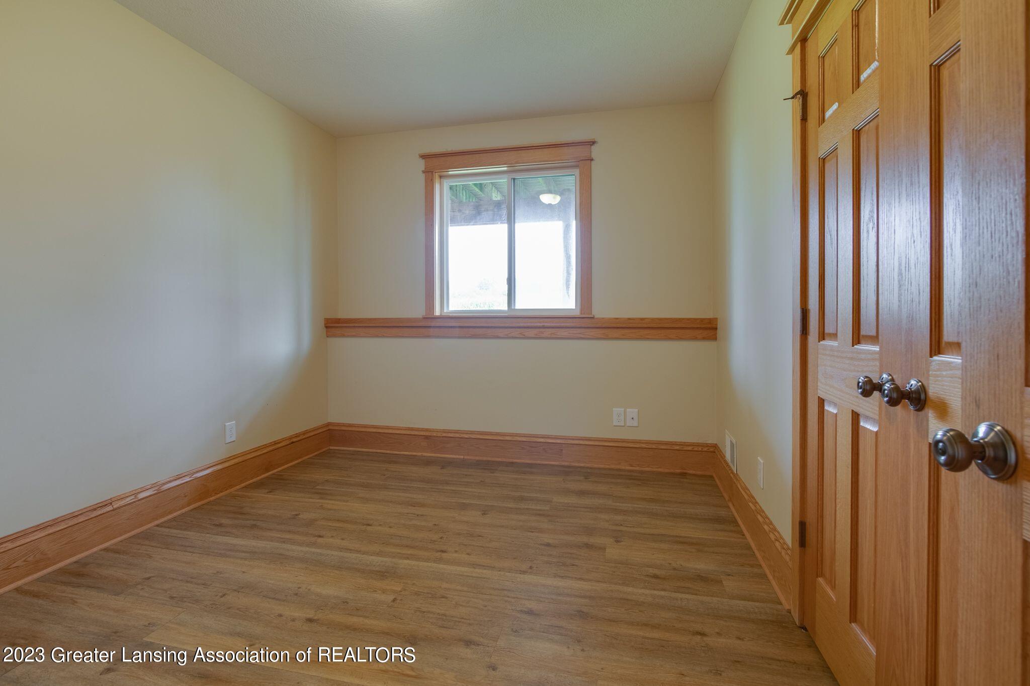 4600 East Clark Road Bath, MI 48808 - Photo 32 of 37 Lower Level Bedroom