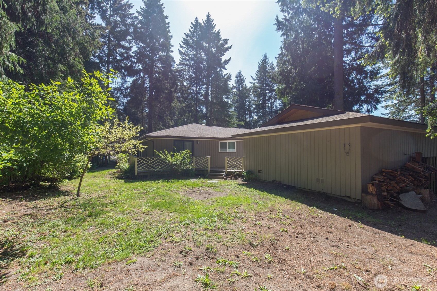 123 Forest Ridge Drive Sequim, WA 98382 - Photo 8 of 32 a backyard of a house with lots of green space