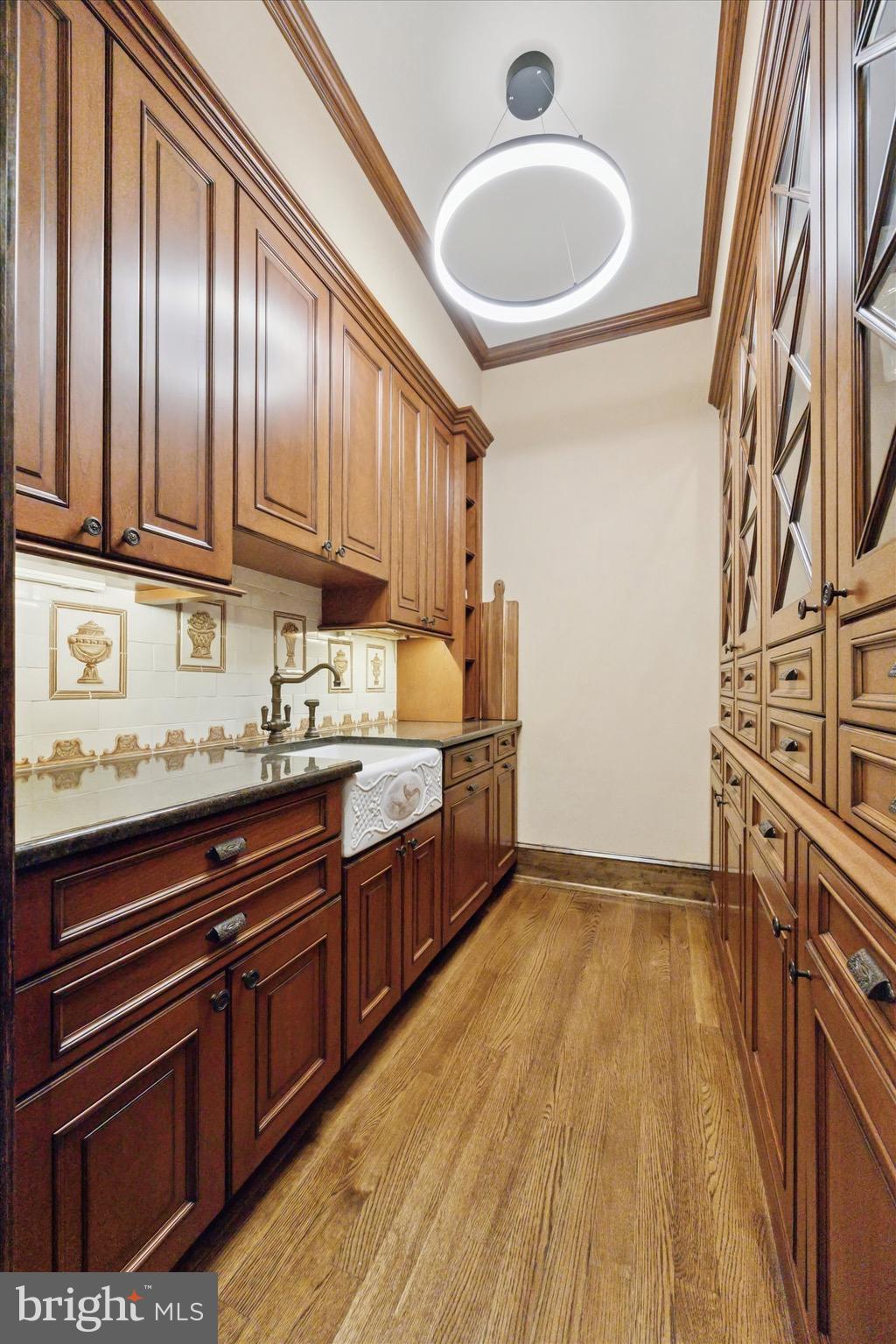 631 Harts Ridge Road Conshohocken, PA 19428 - Photo 11 of 62 a kitchen with granite countertop wooden cabinets and a sink