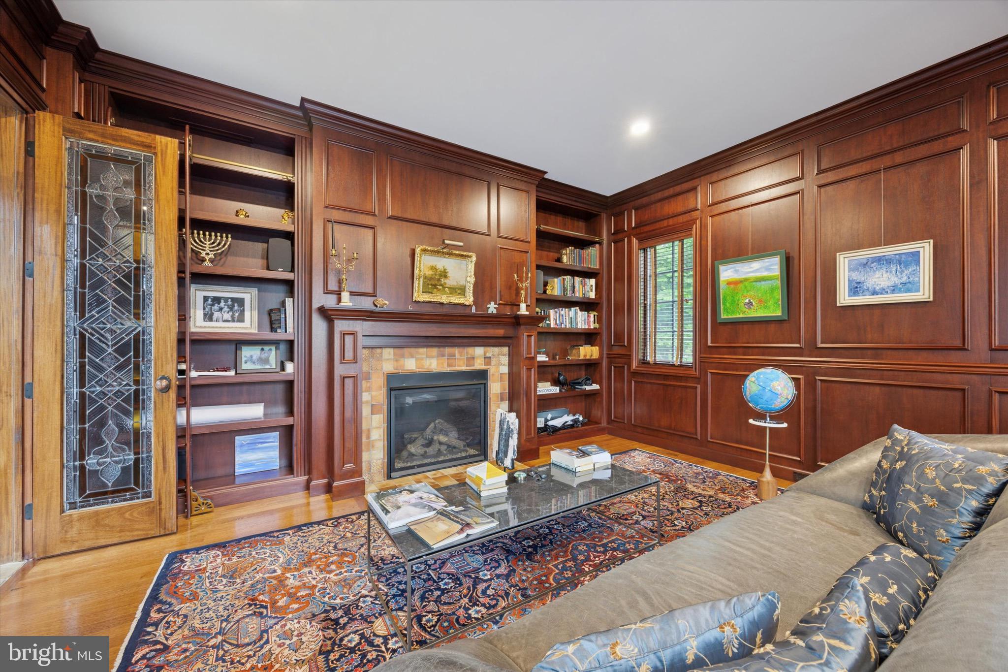 631 Harts Ridge Road Conshohocken, PA 19428 - Photo 13 of 62 a living room with furniture a rug and a fireplace