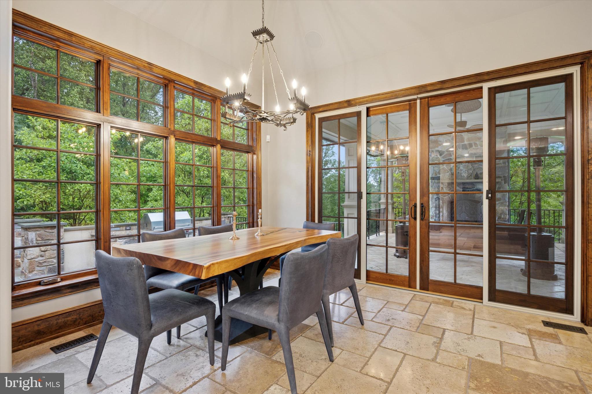631 Harts Ridge Road Conshohocken, PA 19428 - Photo 17 of 62 a dining room with furniture large windows and wooden floor
