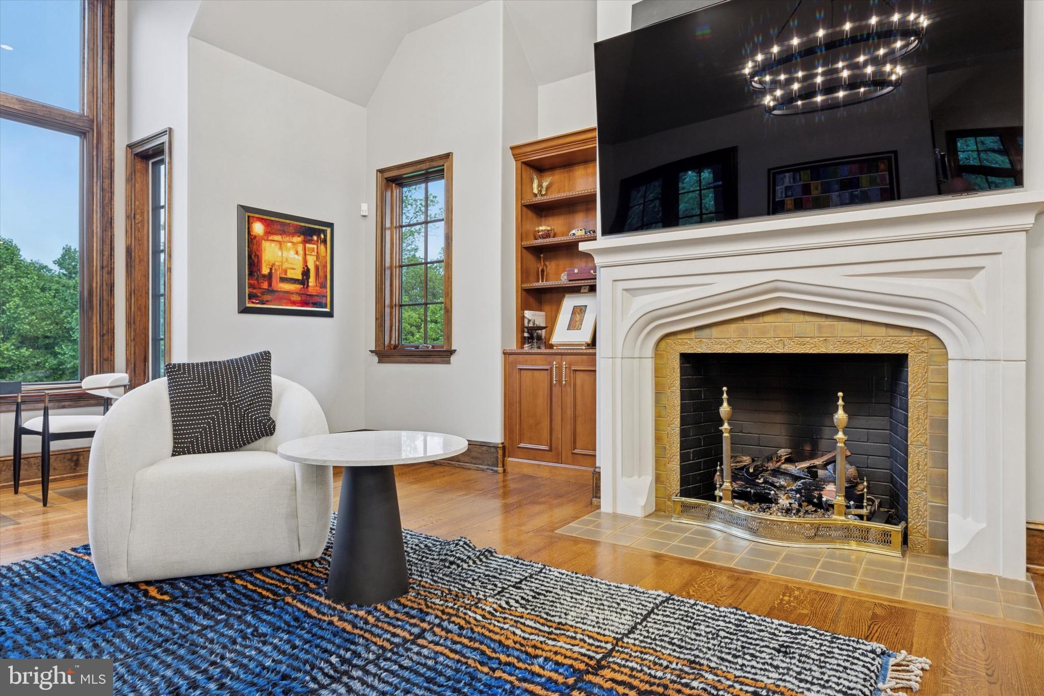 631 Harts Ridge Road Conshohocken, PA 19428 - Photo 20 of 62 a living room with furniture a rug and a fireplace