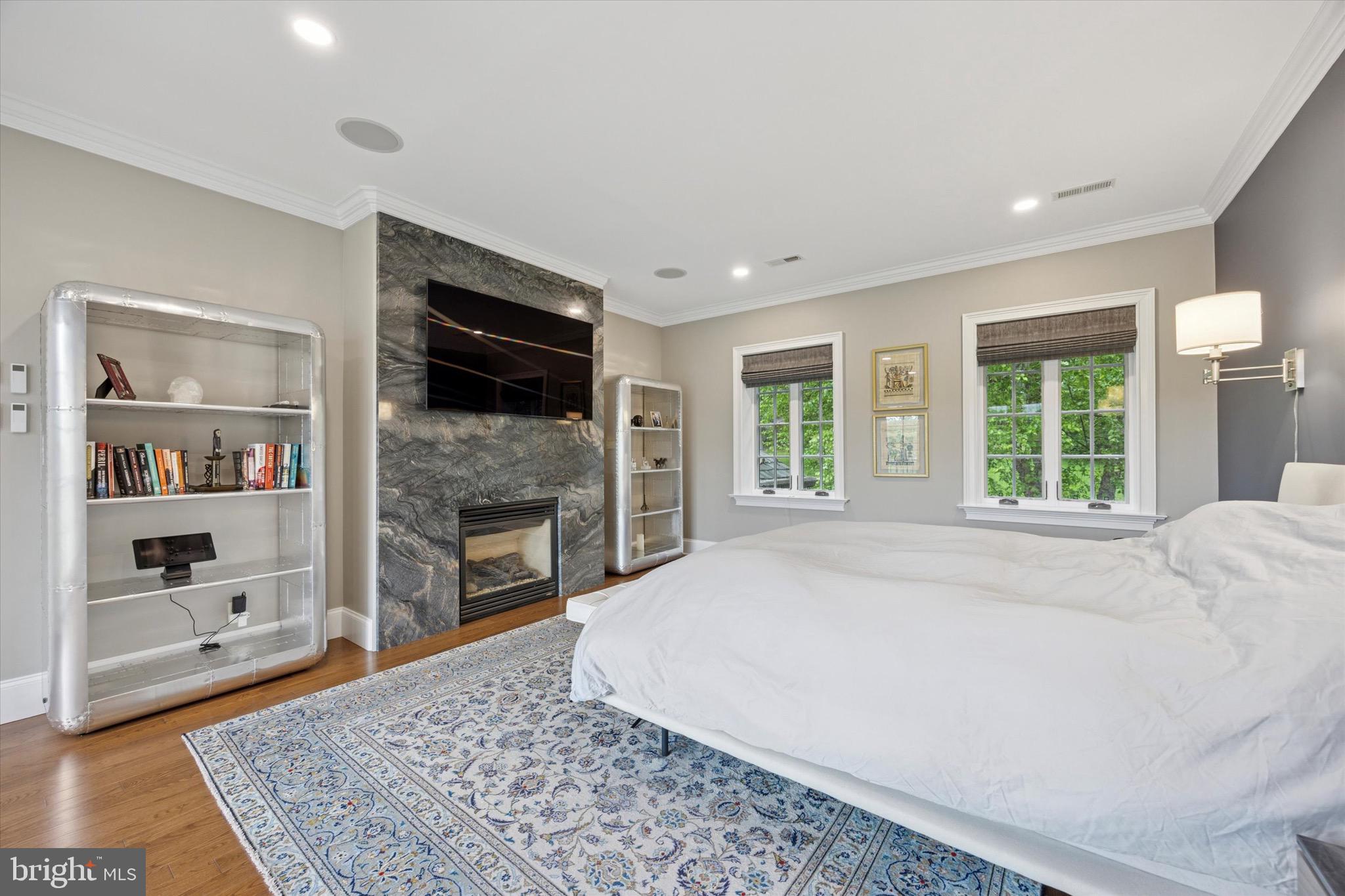 631 Harts Ridge Road Conshohocken, PA 19428 - Photo 23 of 62 a large bedroom with a bed and a fireplace