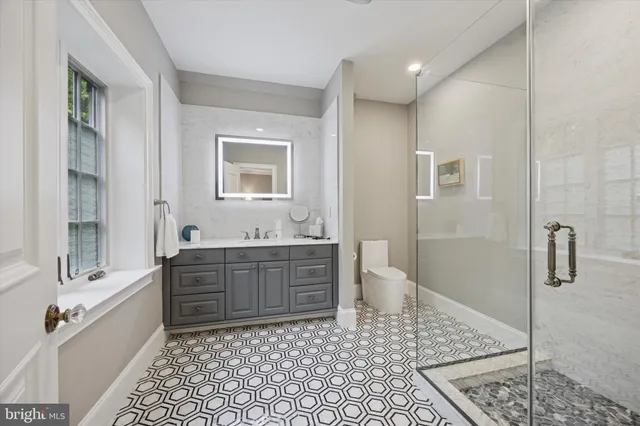 a bedroom with a large bed and a dresser