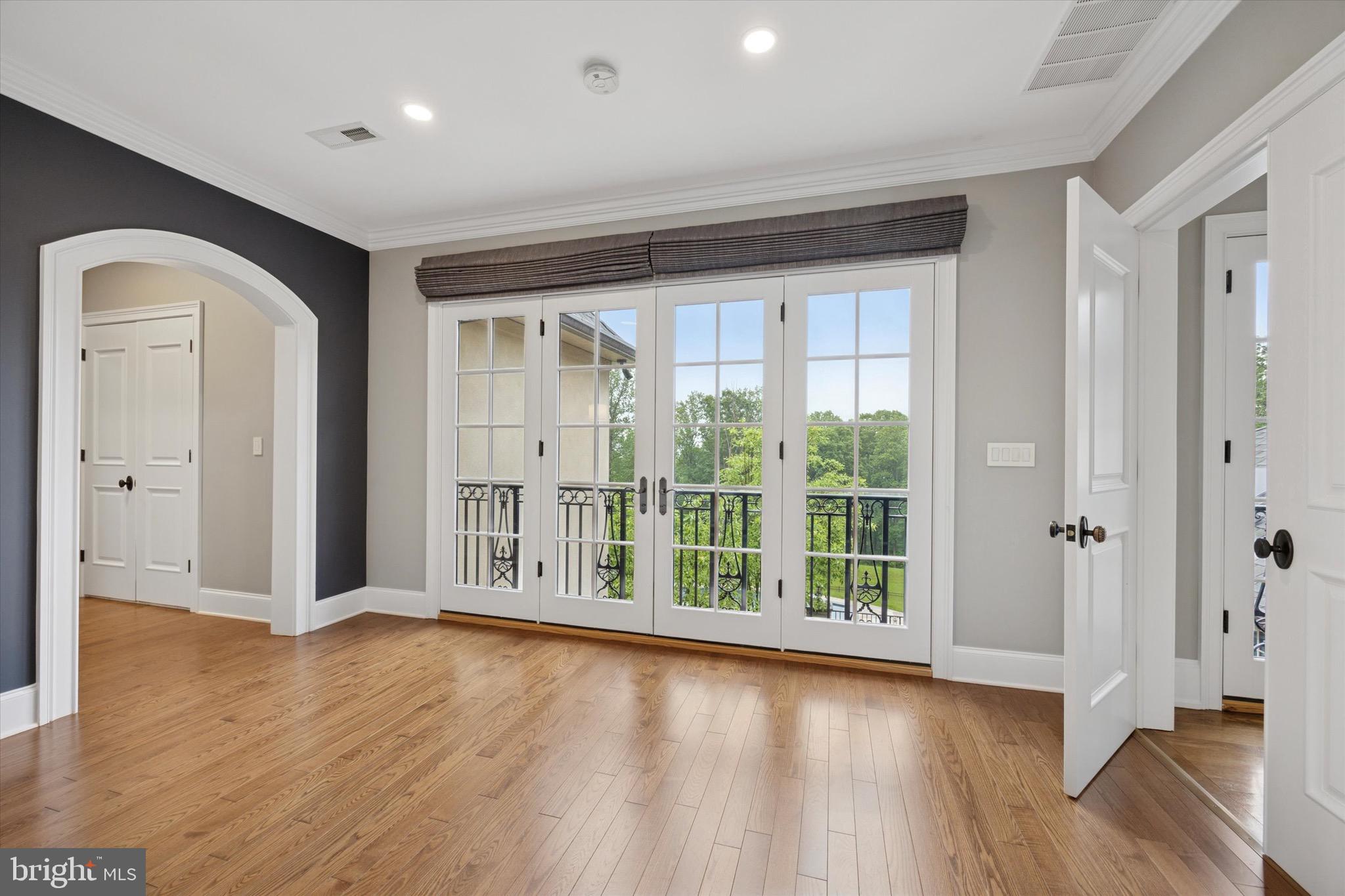 631 Harts Ridge Road Conshohocken, PA 19428 - Photo 30 of 62 an empty room with wooden floor and windows