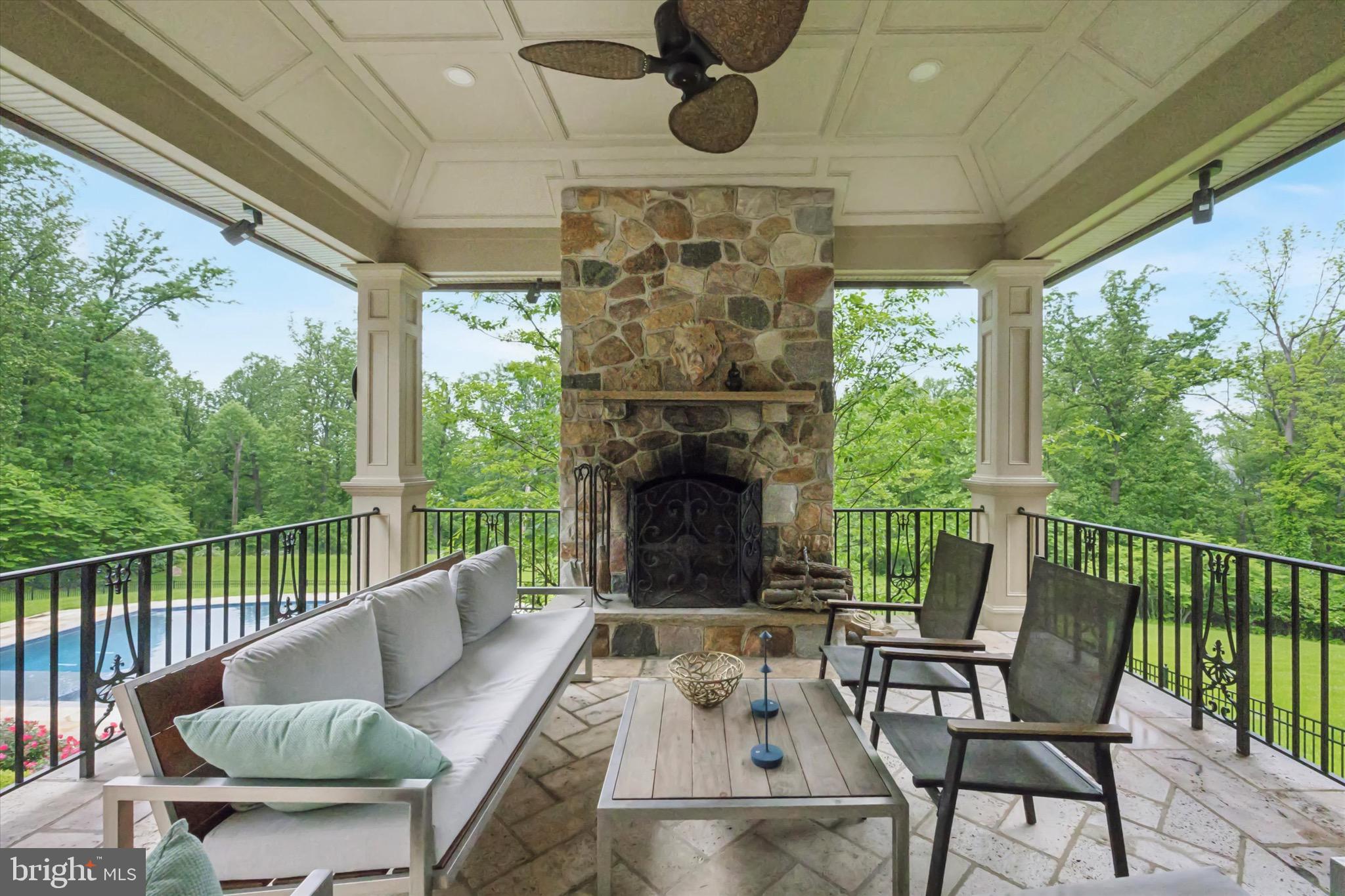 631 Harts Ridge Road Conshohocken, PA 19428 - Photo 31 of 62 a balcony with furniture and a fireplace