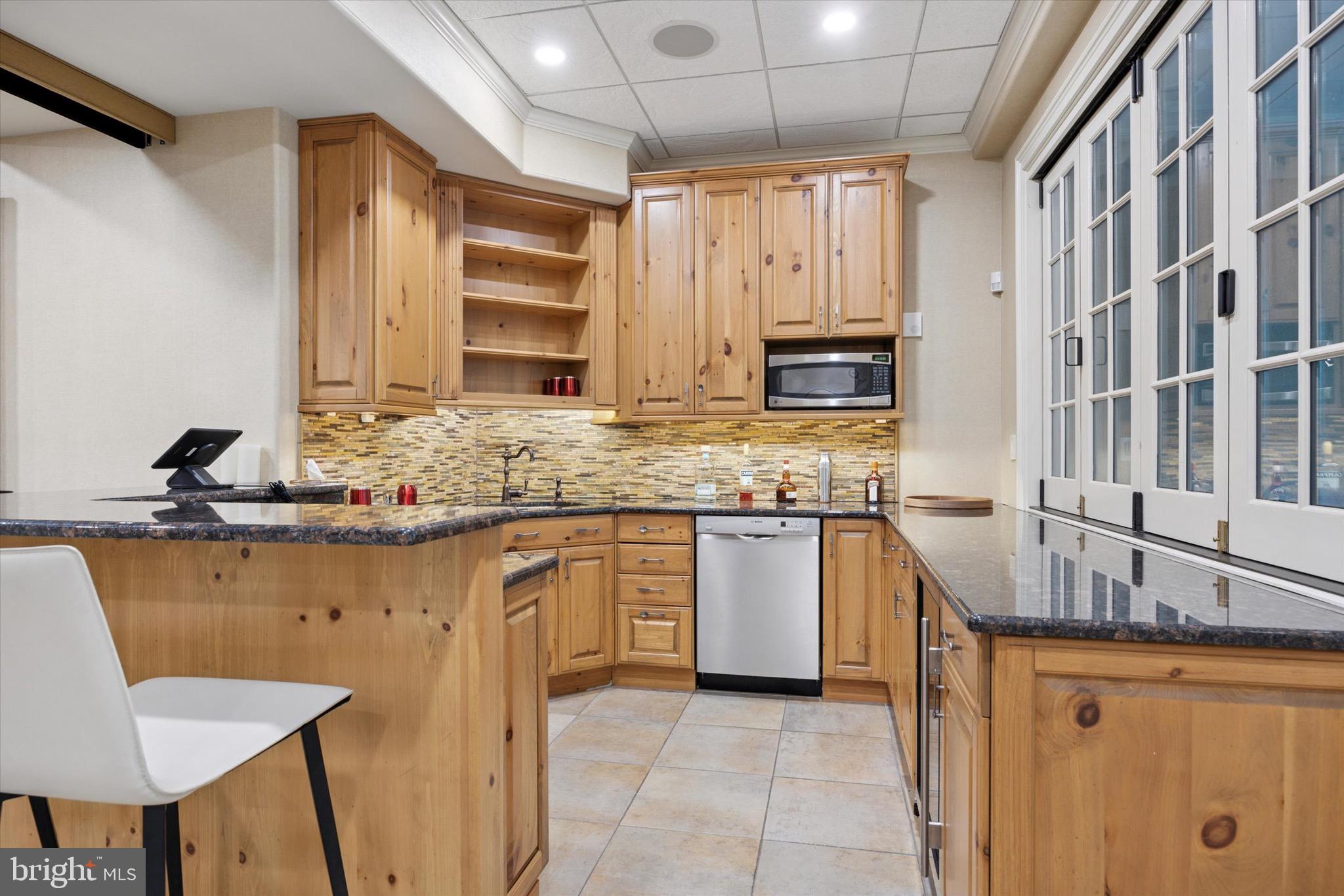 631 Harts Ridge Road Conshohocken, PA 19428 - Photo 42 of 62 a kitchen with stainless steel appliances granite countertop a sink and a stove