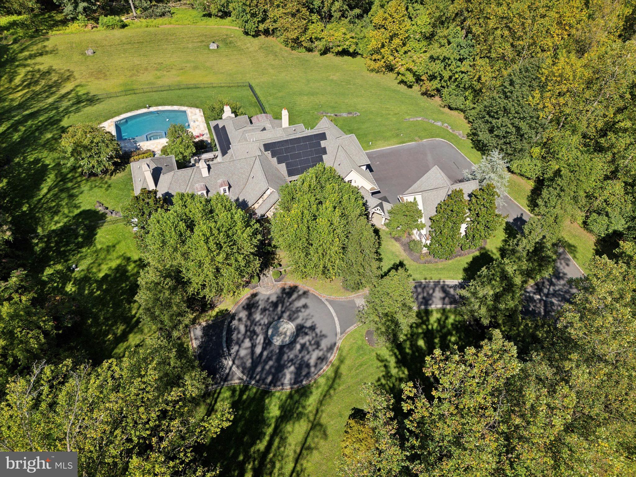 631 Harts Ridge Road Conshohocken, PA 19428 - Photo 59 of 62 an aerial view of a house with a yard swimming pool outdoor seating and yard
