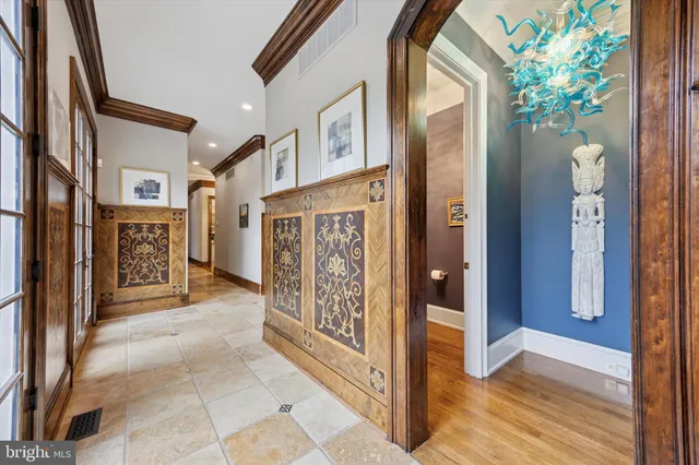 a kitchen with a sink refrigerator and cabinets