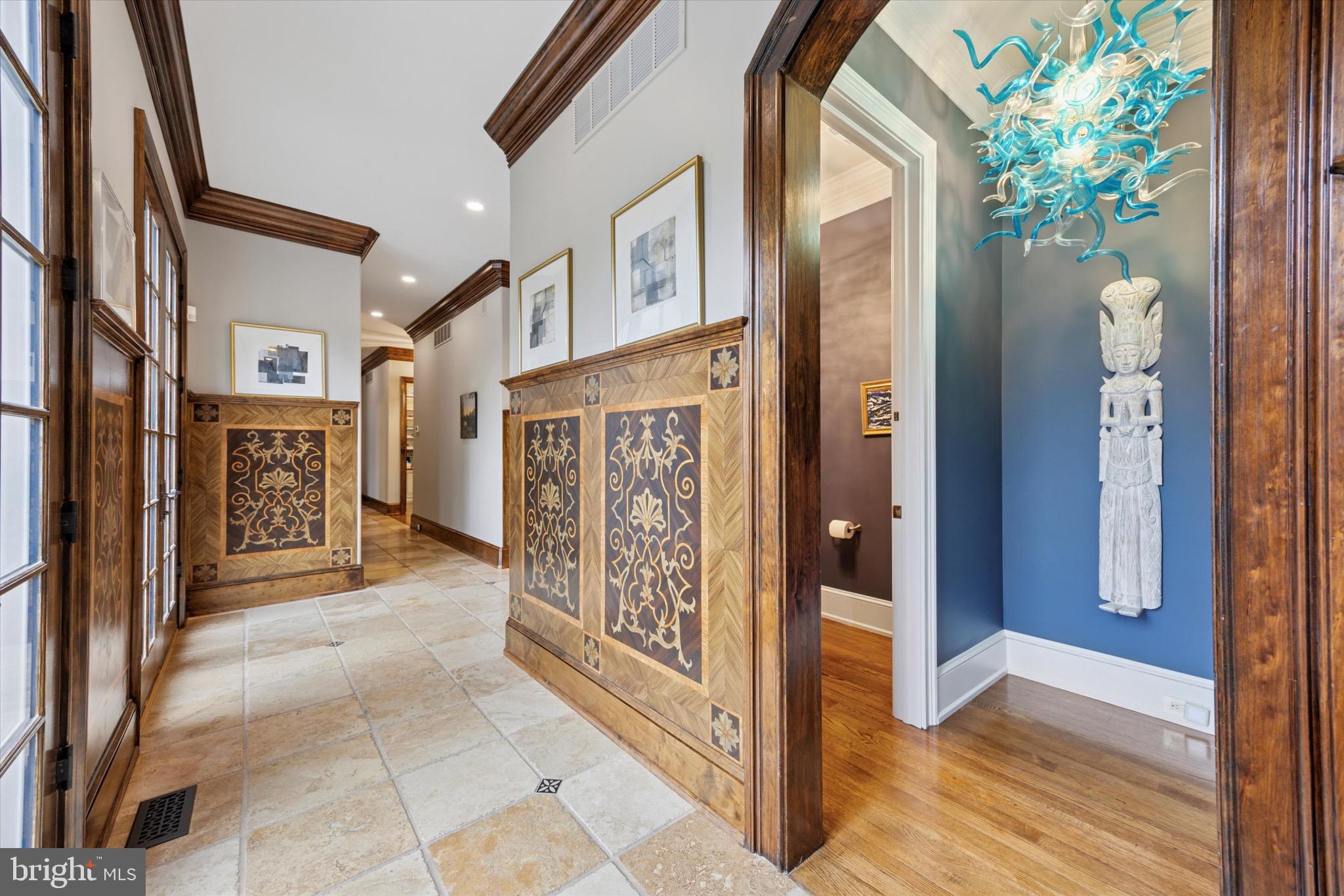 631 Harts Ridge Road Conshohocken, PA 19428 - Photo 6 of 62 a view of an entryway with paintings on the wall