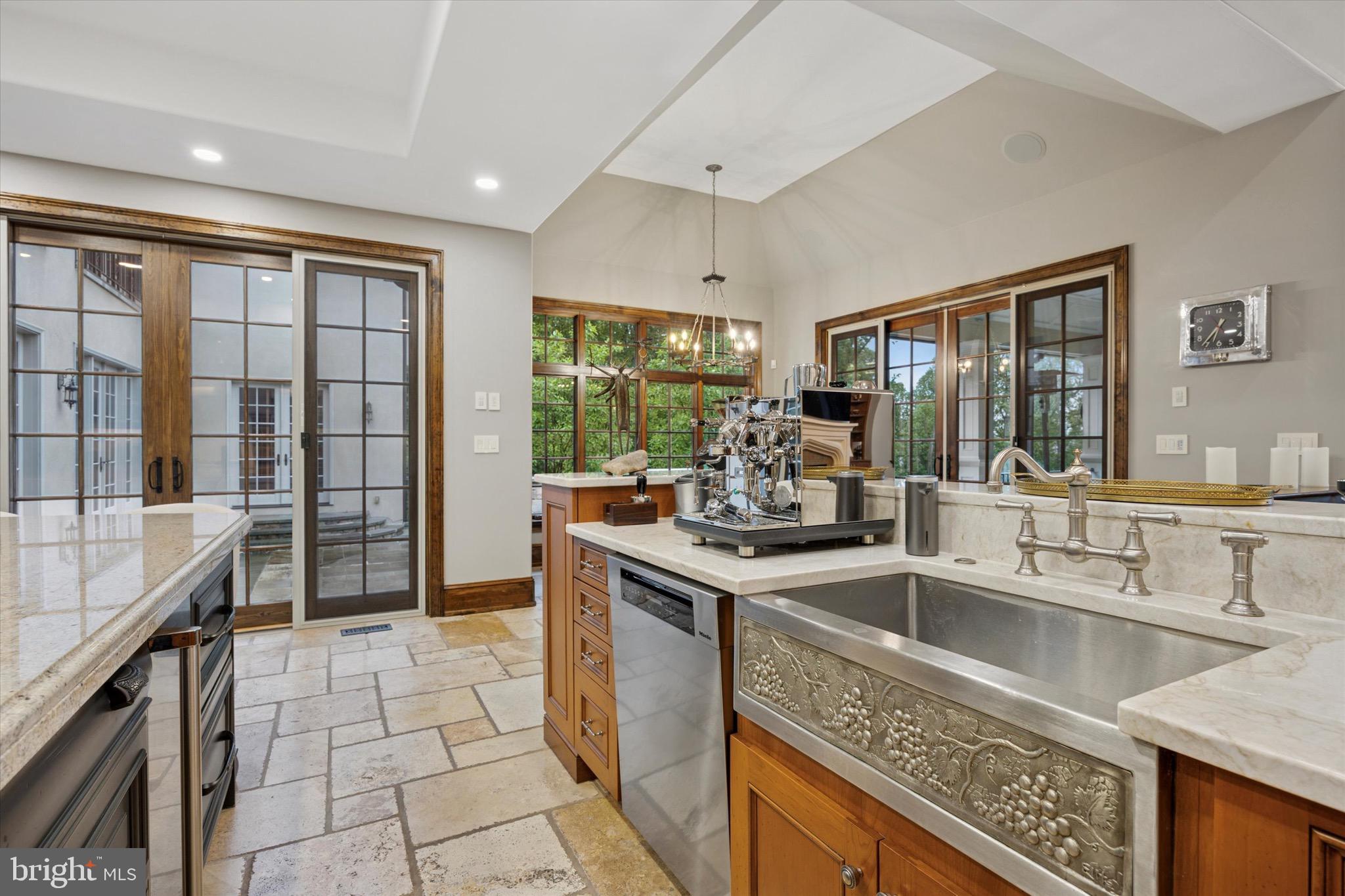 631 Harts Ridge Road Conshohocken, PA 19428 - Photo 10 of 62 a kitchen with stainless steel appliances granite countertop a sink stove and cabinets