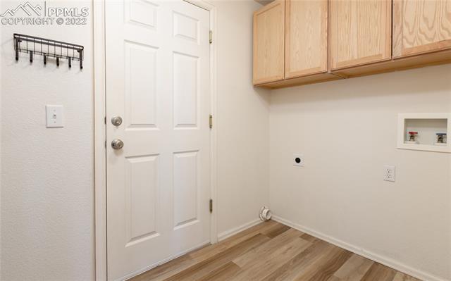 8487 Tibbs Road Peyton, CO 80831 - Photo 14 of 32 Main laundry room leading to garage