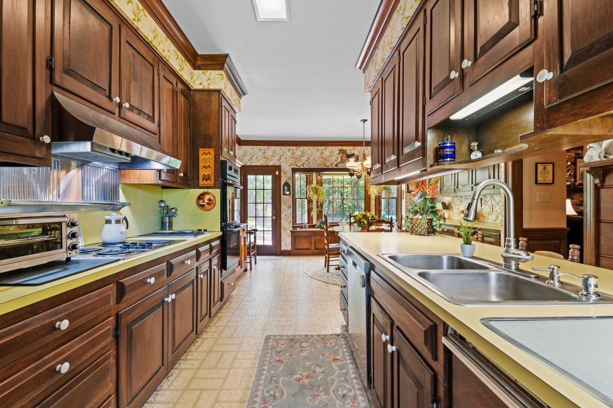 5101 Holly Ridge Farm Road Raleigh, NC 27616 - Photo 10 of 63 Unique Kitchen with a ton of storage space! Benches under front and back windows also open for added storage. Kitchen