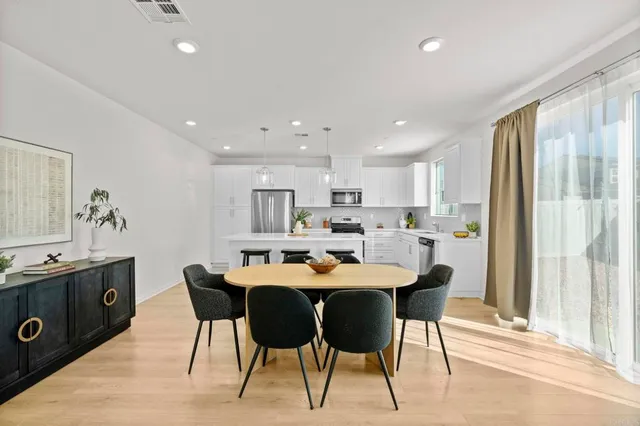 a dining room with a table chairs and a dining table