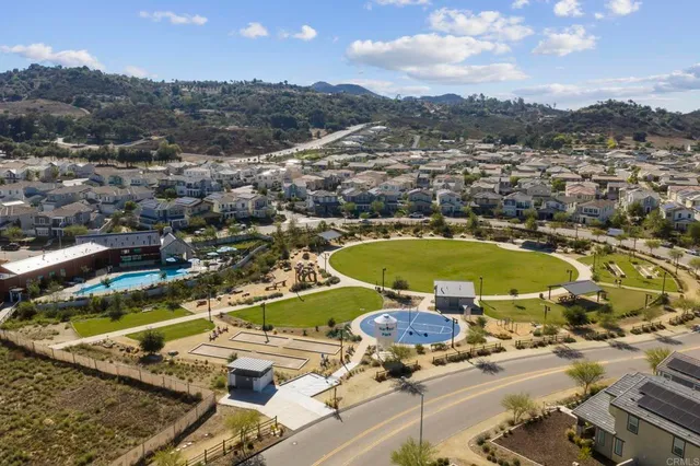 an aerial view of residential houses with outdoor space