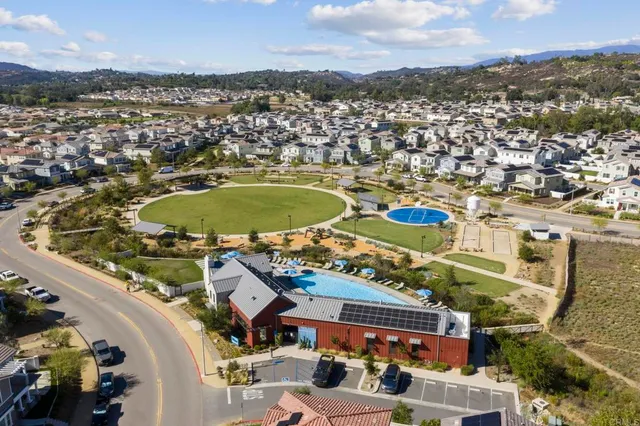 an aerial view of residential building and lake