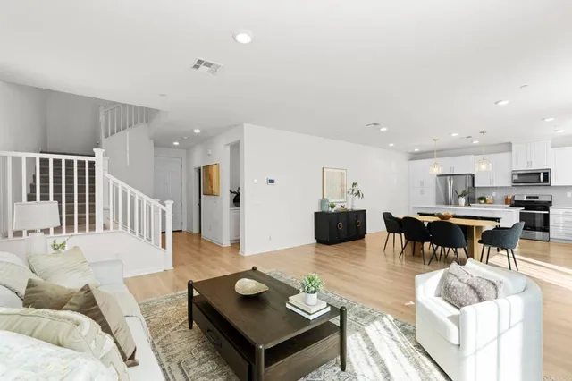 a living room with furniture and a table