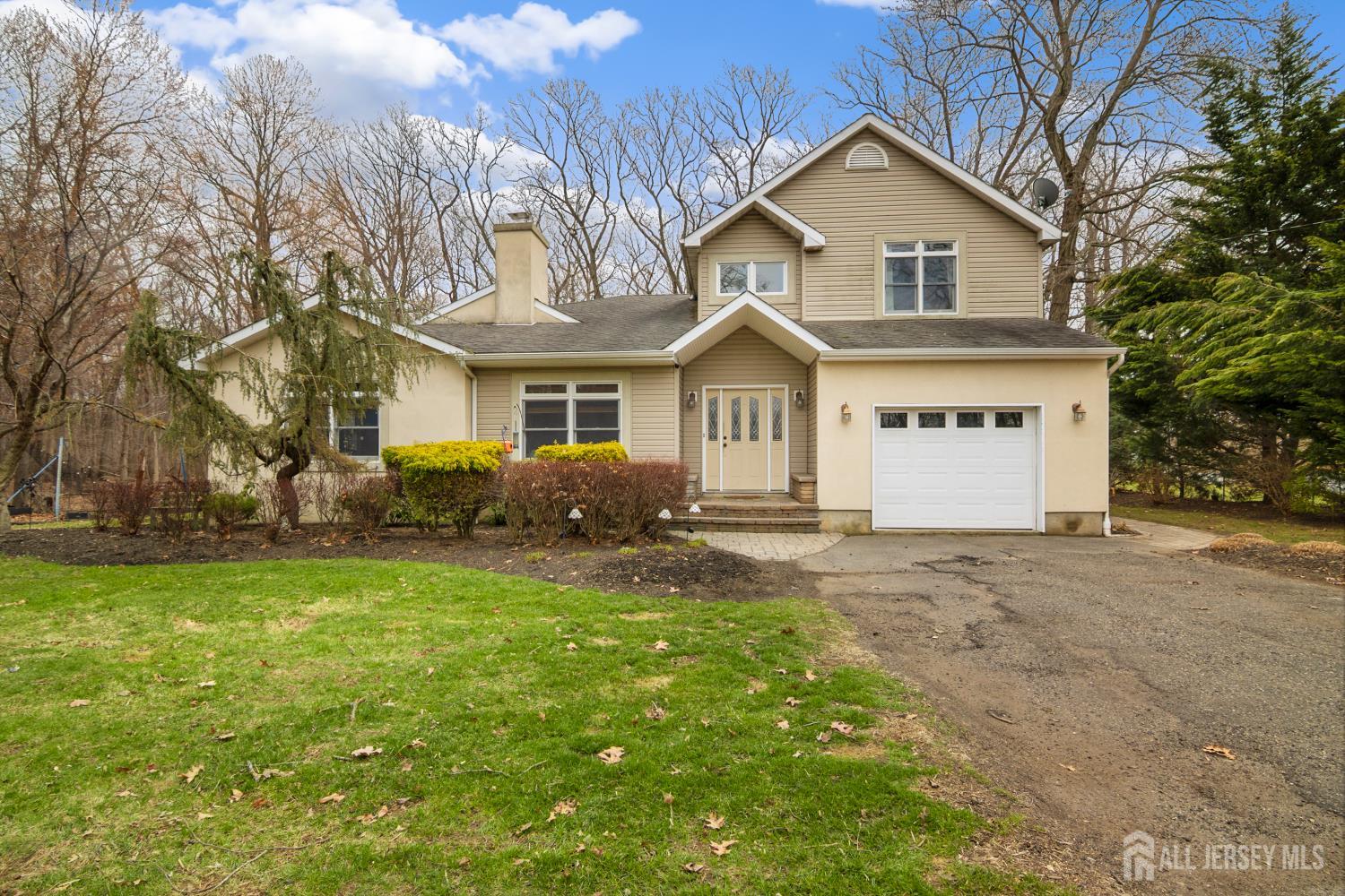 238 Princeton Hightstown Road Cranbury, NJ 08512 - Photo 1 of 51 a front view of a house with a garden and trees