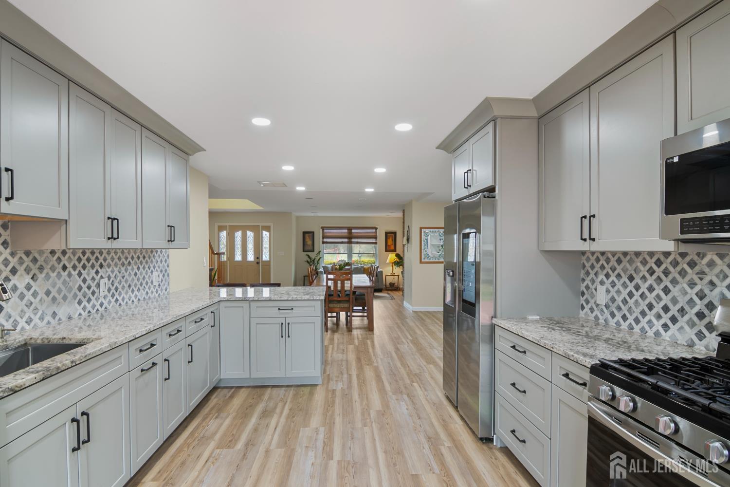 238 Princeton Hightstown Road Cranbury, NJ 08512 - Photo 11 of 51 a kitchen with a sink stainless steel appliances and cabinets