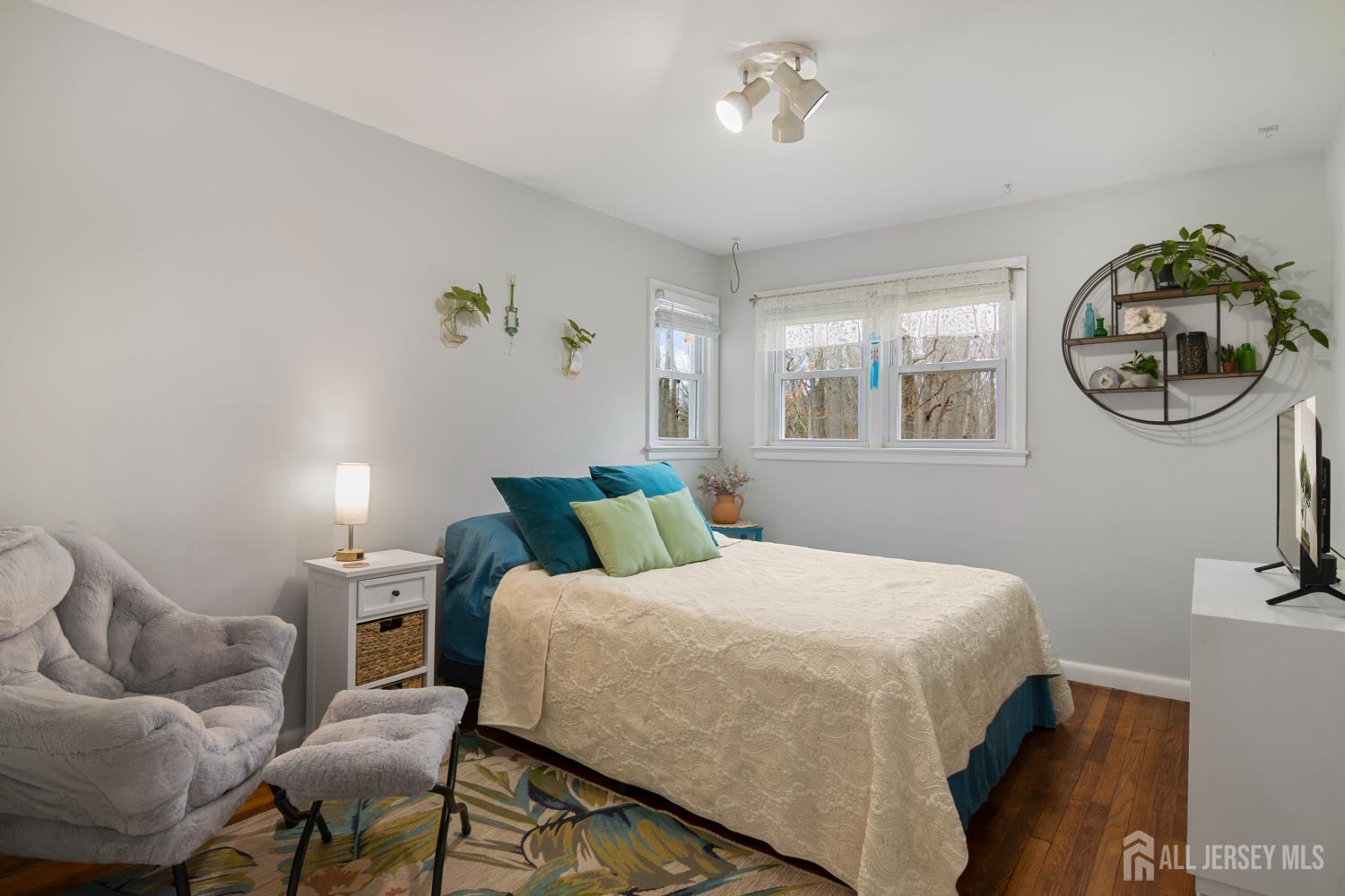 238 Princeton Hightstown Road Cranbury, NJ 08512 - Photo 17 of 51 a bed room with a bed and a chandelier