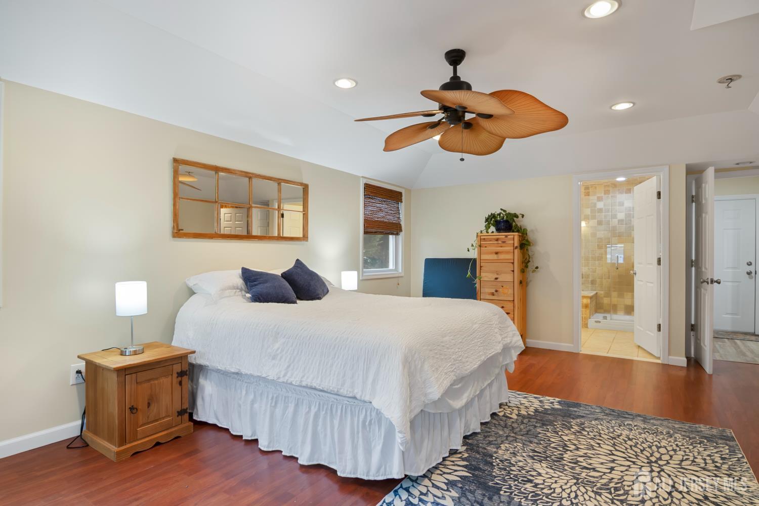 238 Princeton Hightstown Road Cranbury, NJ 08512 - Photo 19 of 51 a bedroom with a bed and wooden floor