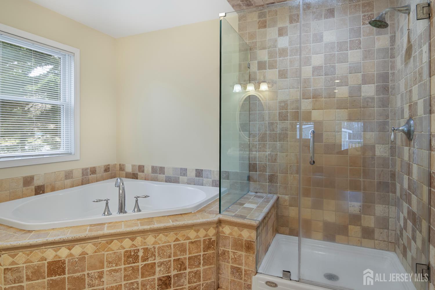 238 Princeton Hightstown Road Cranbury, NJ 08512 - Photo 21 of 51 a bathroom with a bathtub and shower