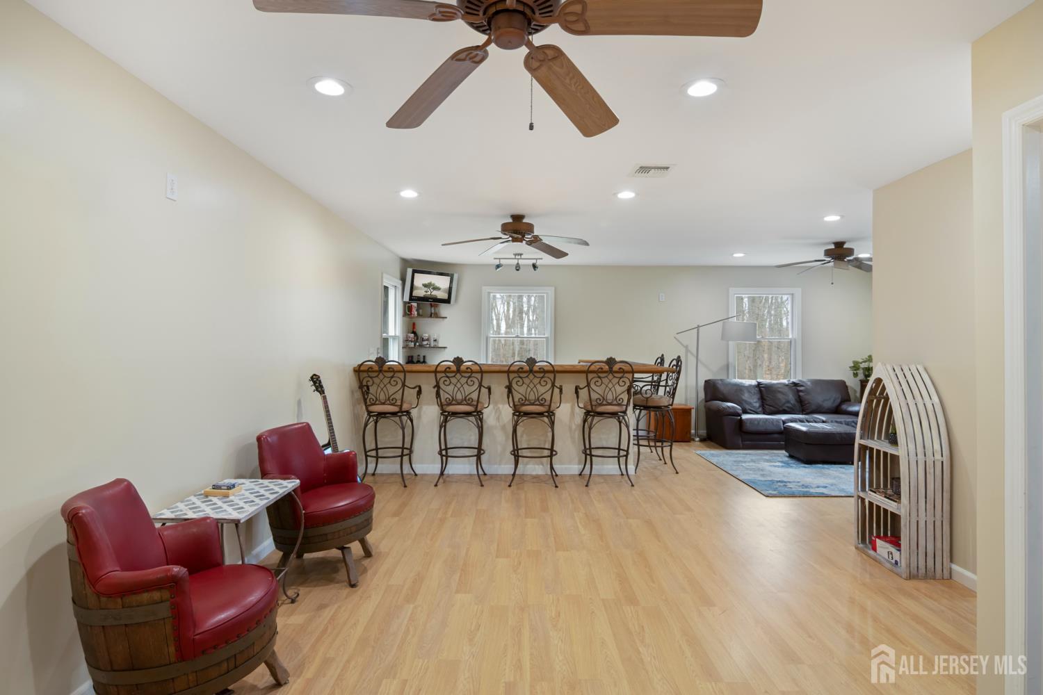 238 Princeton Hightstown Road Cranbury, NJ 08512 - Photo 24 of 51 a living room with furniture a rug and white walls