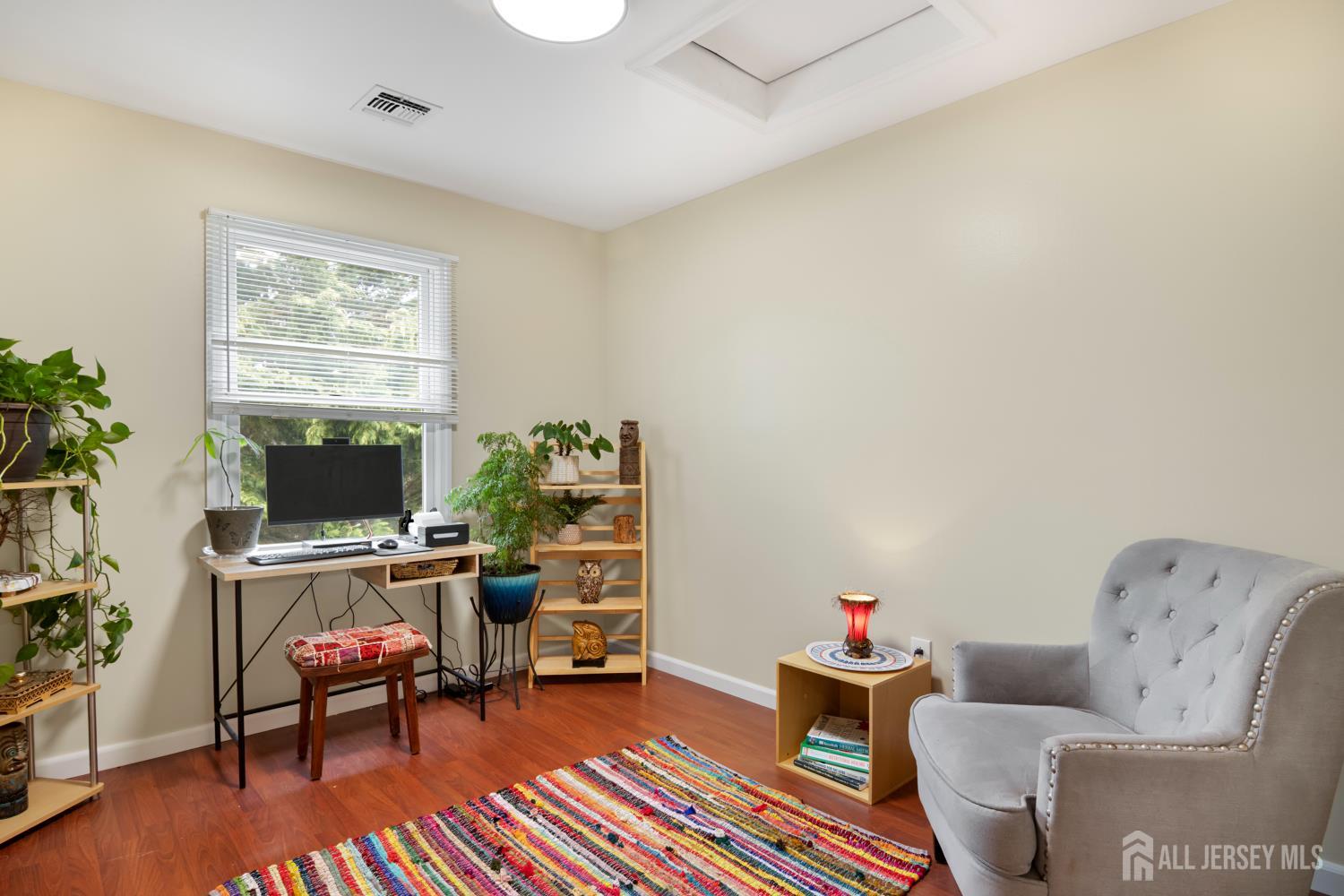 238 Princeton Hightstown Road Cranbury, NJ 08512 - Photo 28 of 51 a living room with furniture and a flat screen tv