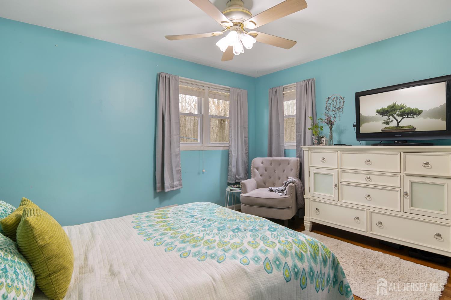 238 Princeton Hightstown Road Cranbury, NJ 08512 - Photo 30 of 51 a bedroom with a bed and a chandelier