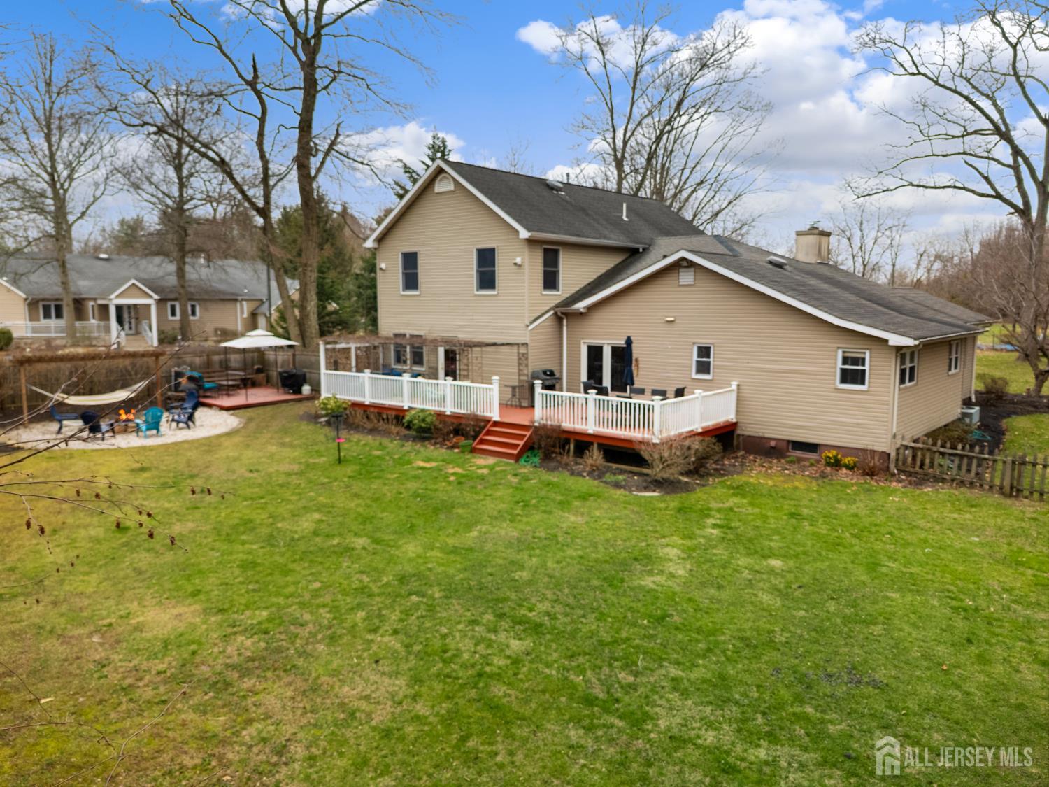 238 Princeton Hightstown Road Cranbury, NJ 08512 - Photo 44 of 51 a view of a house with a yard patio and fire pit