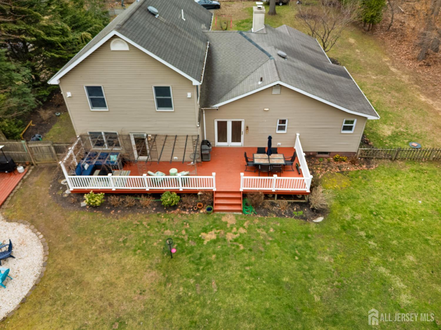 238 Princeton Hightstown Road Cranbury, NJ 08512 - Photo 47 of 51 a backyard of a house with table and chairs