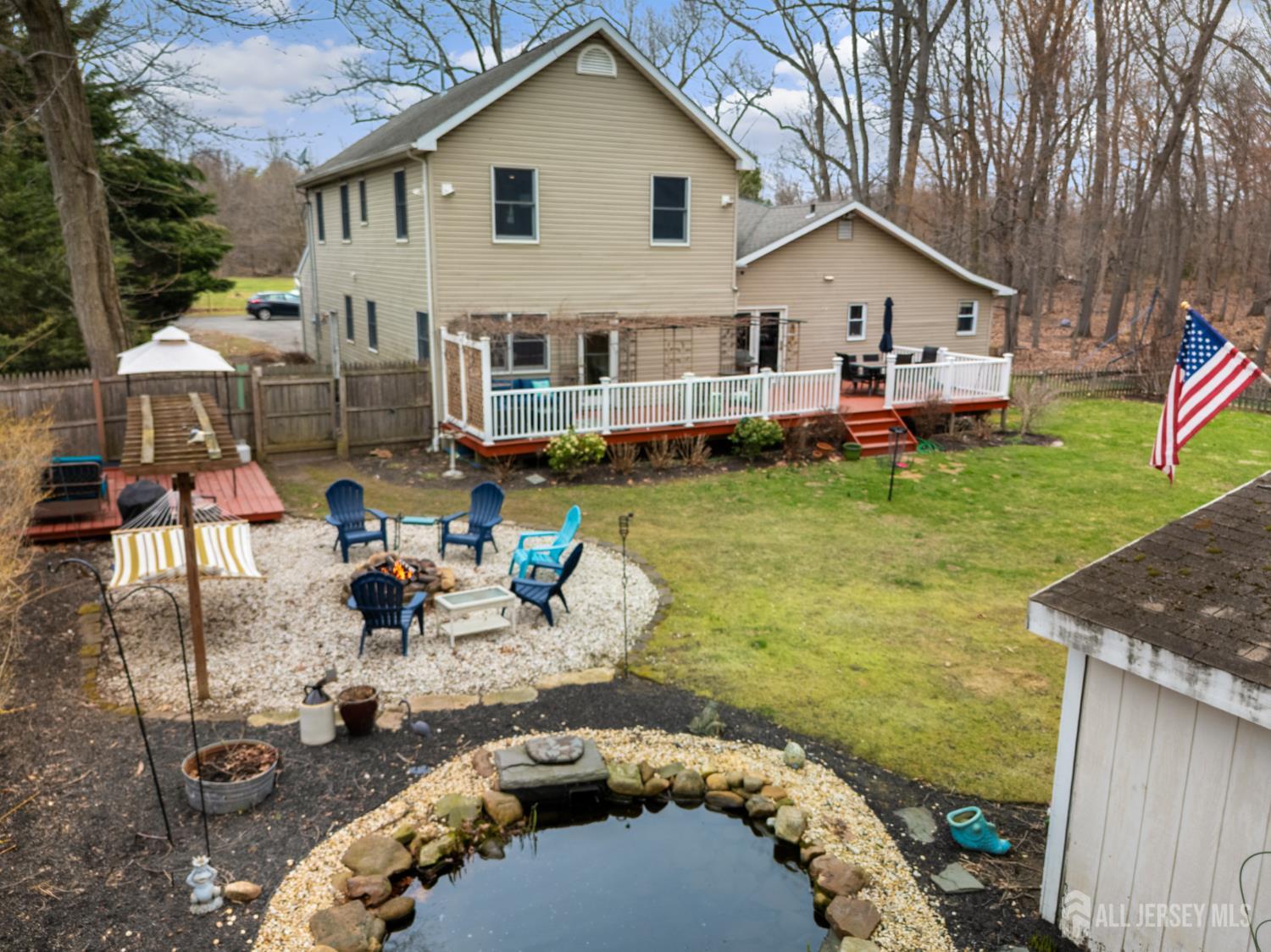 238 Princeton Hightstown Road Cranbury, NJ 08512 - Photo 49 of 51 a view of a house with backyard patio and swimming pool