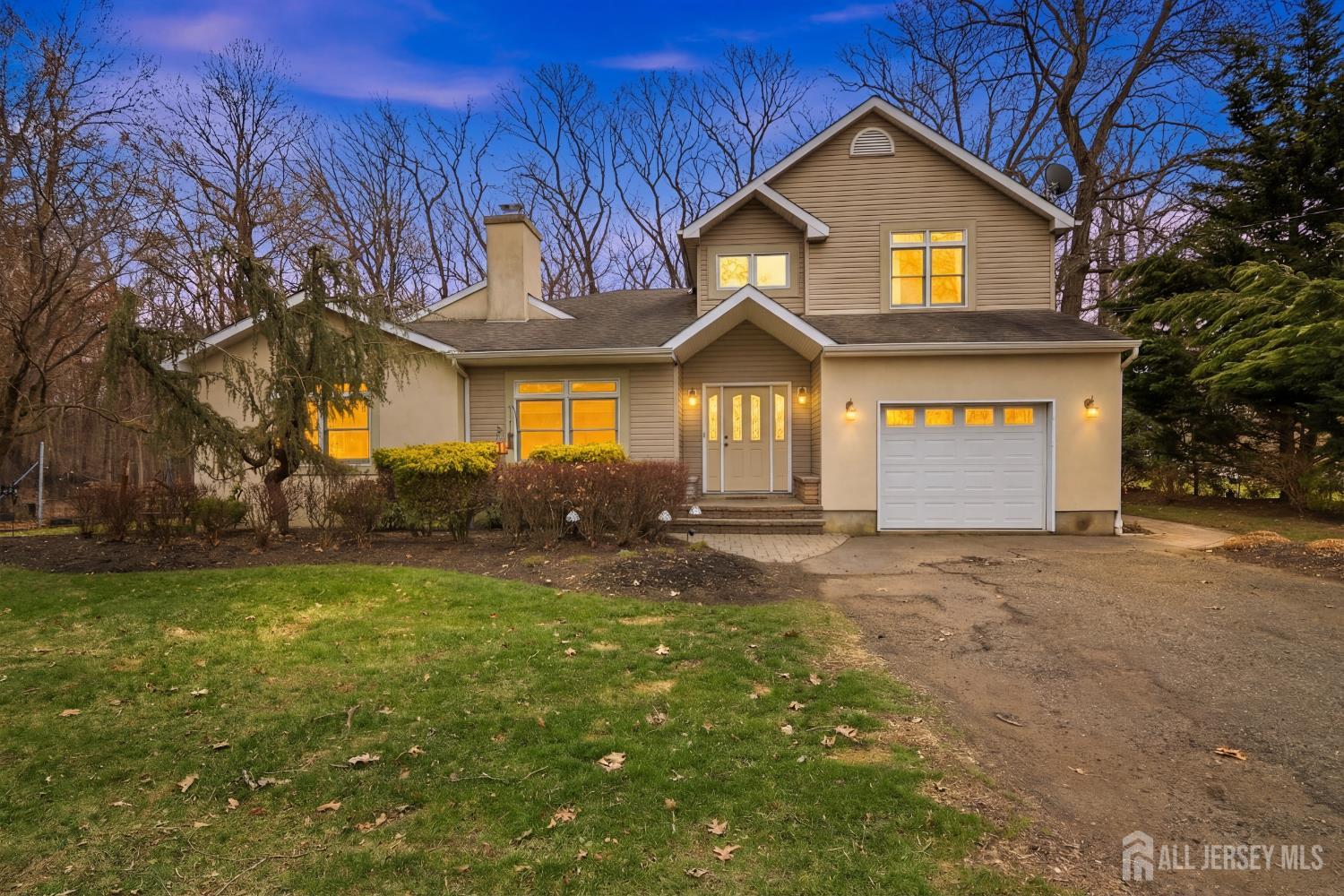 238 Princeton Hightstown Road Cranbury, NJ 08512 - Photo 50 of 51 a front view of a house with a yard and garage
