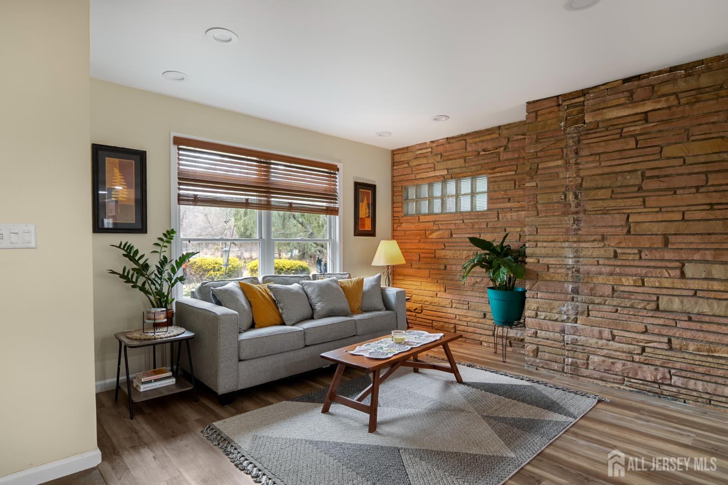 238 Princeton Hightstown Road Cranbury, NJ 08512 - Photo 5 of 51 a living room with furniture and a potted plant