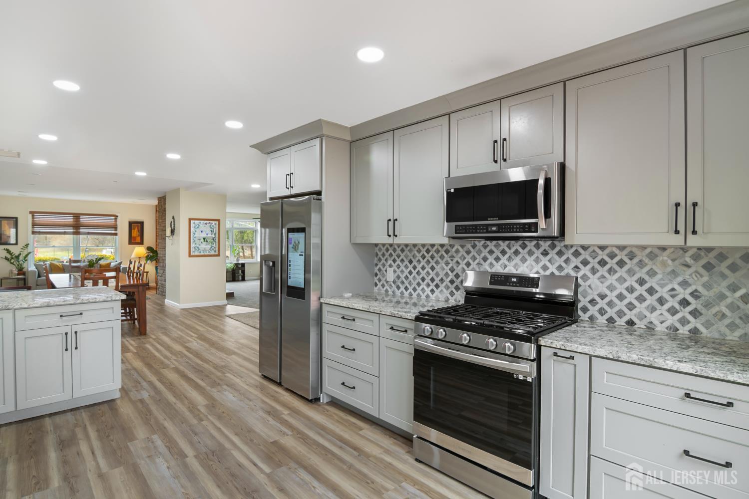 238 Princeton Hightstown Road Cranbury, NJ 08512 - Photo 9 of 51 a kitchen with stainless steel appliances a stove microwave and refrigerator