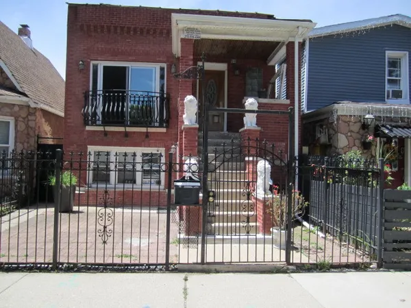 a view of entrance gate of building and street