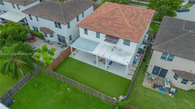 an aerial view of a house with a garden