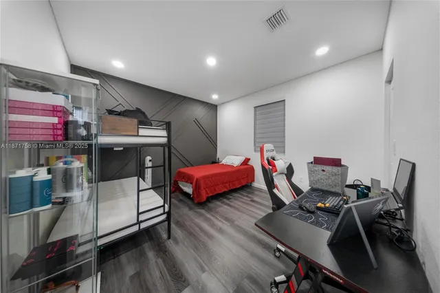 a bedroom with furniture and a window