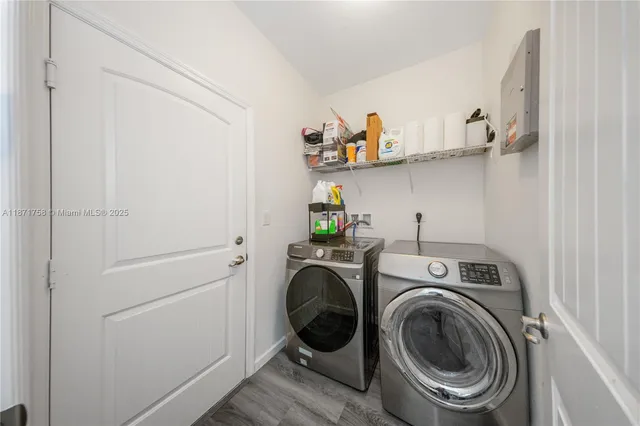 a utility room with dryer and washer