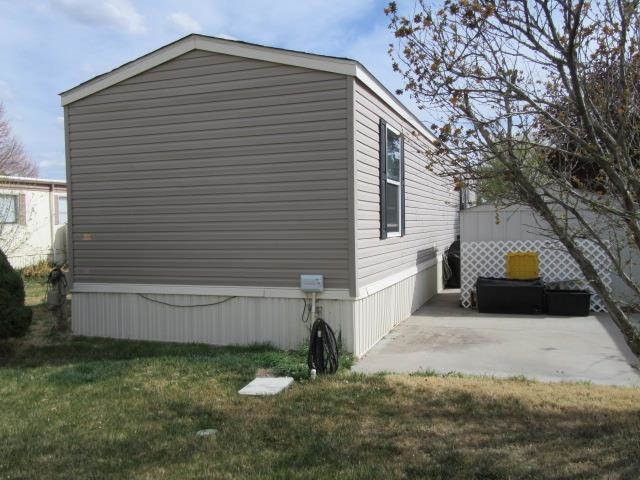 3251 E Road, Unit 99 Clifton, CO 81520 - Photo 7 of 25 a view of a house with a yard